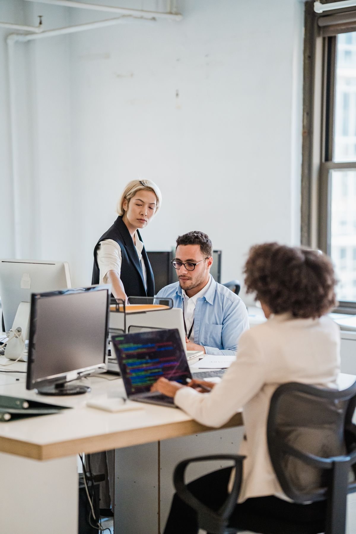 Business team using computers in an office