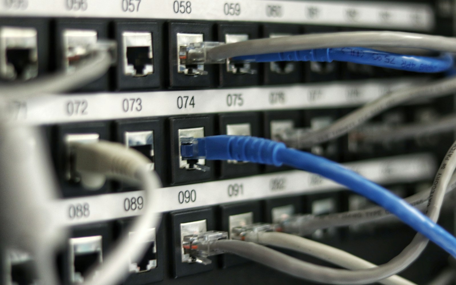 Network patch panel and cabling representing DNS records, providers and routing